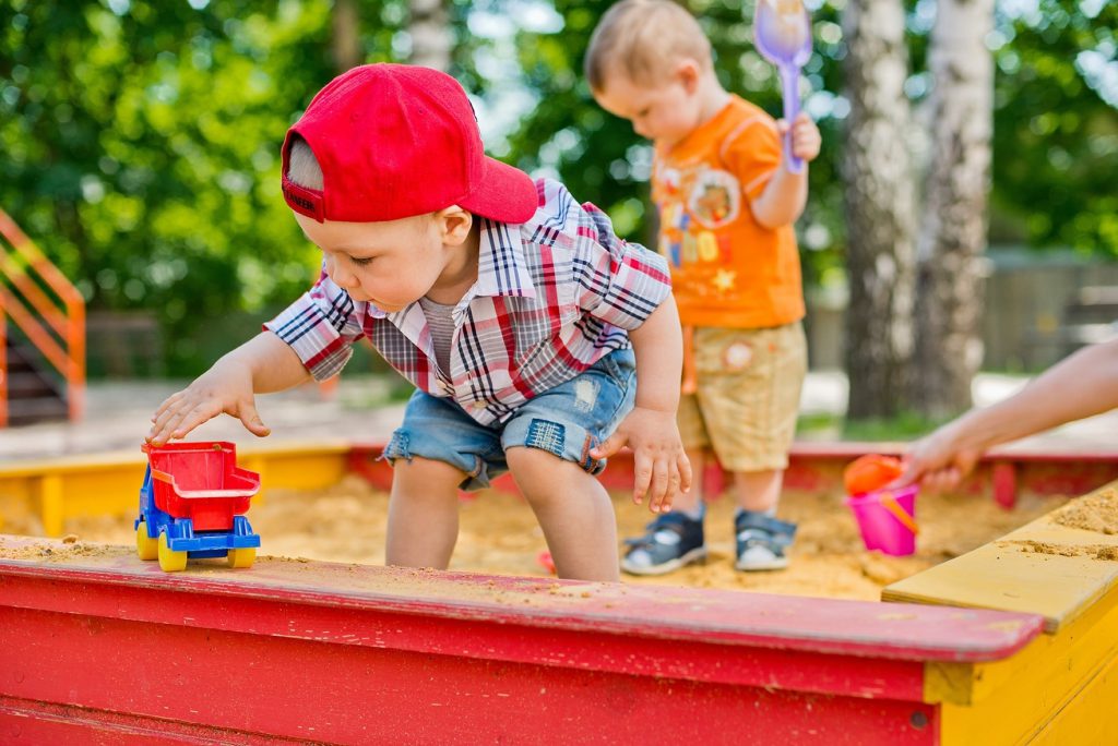 child plays with sand